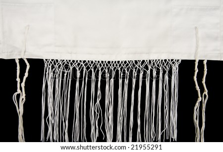 A Jewish prayer shawl, or tallit, showing the fringes, called tzitzit