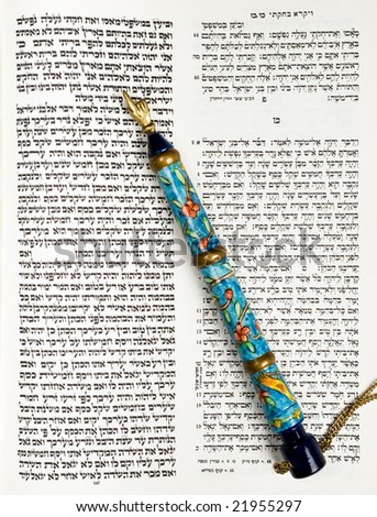 A tikkun book used in Judaism with text both in Hebrew and as it appears in Torah used by Bar Mitzvah for practicing Torah reading, and pointer for holding place in the text.