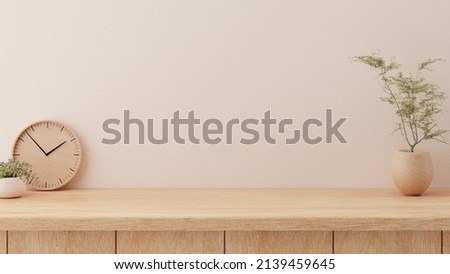 Minimal cozy counter mockup design for product presentation background or branding in Japan style with bright wood counter and warm white wall include vase plant and clock. Kitchen interior  Foto d'archivio © 