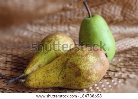 Three pears on paper layer