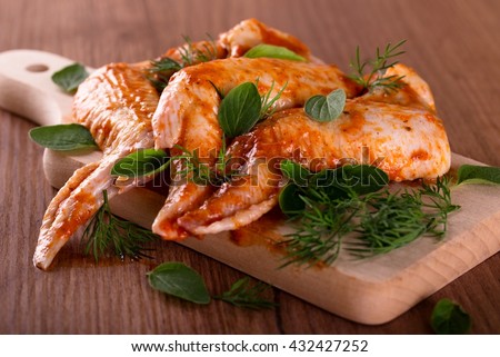 Similar – Image, Stock Photo Roasted marinated chicken pieces with vegetables in black baking dish