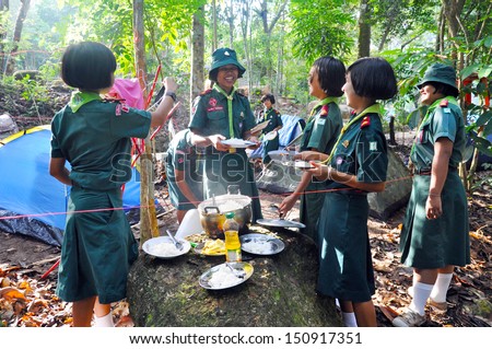 CHUMPHON,THAILAND February 16: Unidentified Thai girl scouts in Camp to were eating breakfast as part of the study on February 16, 2012 in Chumphon,Thailand.