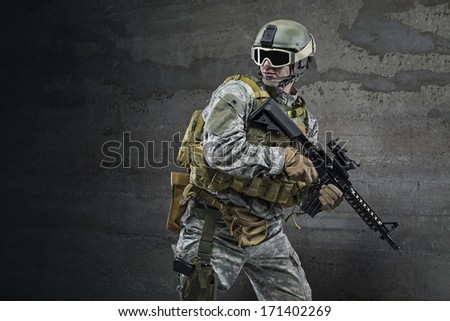 Soldier with rifle and mask