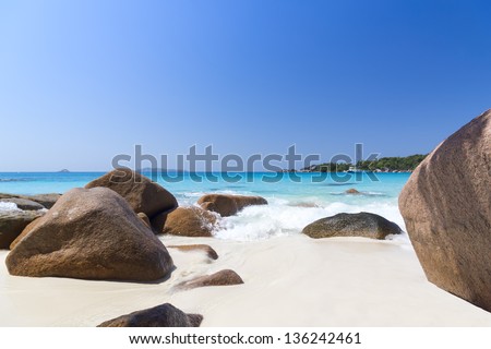 Mahe island, Seychelles. Anse Soleil, lazare bay (Beach). The island of dreams for a rest and relaxation. White coral beach sand. Sailing yacht on background.