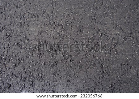 New black fresh asphalt road surface layer- Road Construction Repair