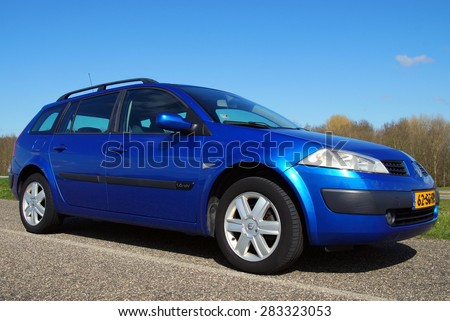 Almere, Flevoland, The Netherlands - March 17, 2015: Metallic Blue Renault Megane Grand Tour II 1.6 16V Tech Line. This model 2005 is the second generation of the popular French family car