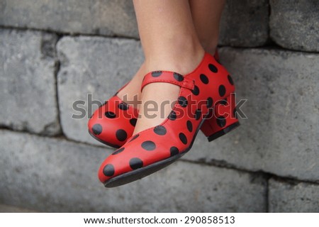 Spanish flamenco red dance shoes - crosslegged girl