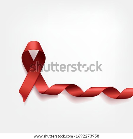 symbolic red ribbon on white background. The AIDS Problem and 
anorexia memorial day
