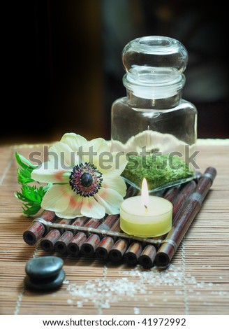 bottle with mint flower candle stones salt for spa