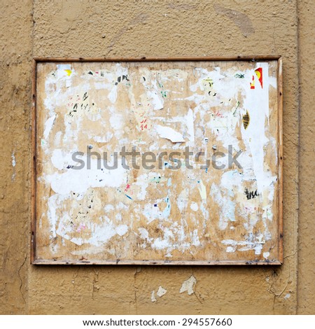 Vintage bulletin Square board. aged dirty street wall background.