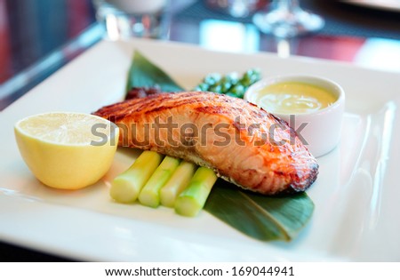 Salmon steak cooked in asian style on restaurant table