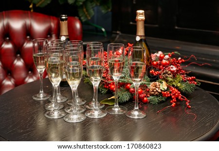 Glasses with champagne on bar lounge table