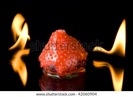 Burning strawberry with flames - really strange thing. (Not imitated)