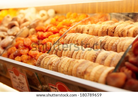 Dried figs and apricots on food store shelf