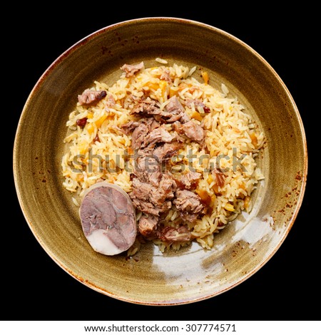 Pilaf, traditional dish of the Middle East, isolated over black