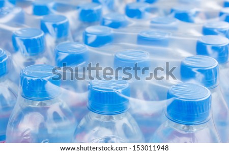Rows of water bottles in plastic wrap
