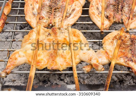 Grilled chicken on stove , Thai street food