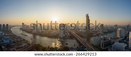 Bangkok, Thailand - April 4, 2015: Birds eye view of Bangkok city along the river during sunset