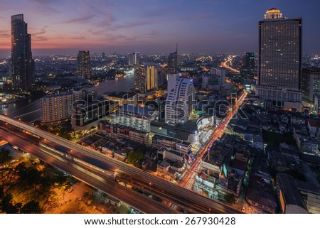 Bangkok, Thailand - April 6, 2015: Birds eye view of Bangkok city along the river during sunset and twillight