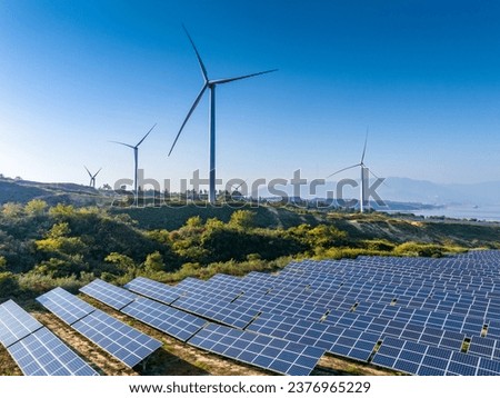 Similar – Image, Stock Photo A wind energy electric windmill turbine in a colorful sunset and landscape