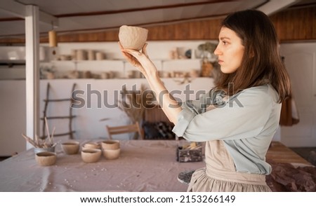 Similar – Image, Stock Photo Ceramist hands make a plate of clay