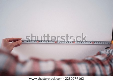 Similar – Image, Stock Photo Workman with measuring tape making surf board