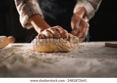 Similar – Image, Stock Photo A dough is kneaded on a kitchen table and dusted with flour