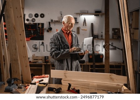 Similar – Image, Stock Photo Senior male woodworker working in garage