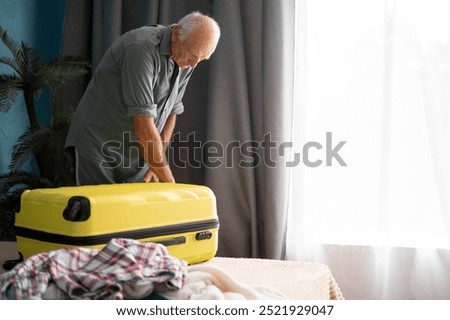 Similar – Image, Stock Photo Senior man organizing his medication into pill dispenser. Senior man taking pills from box