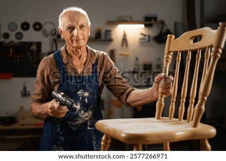 Similar – Image, Stock Photo Senior male woodworker working in garage
