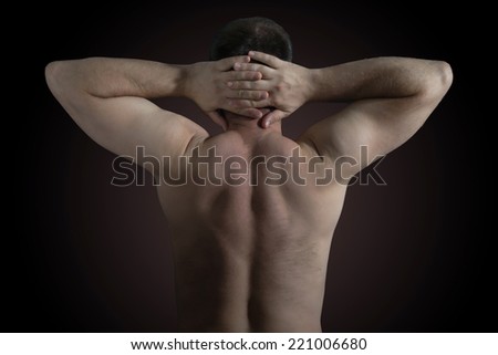 Man shows his back for a medical check