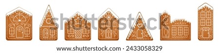 Set of cute cartoon gingerbread houses with icing glazed roofs. Vintage ginger bread town isolated on white background. Christmas fantasy city made of cookies. New Year sweets. Vector illustration.