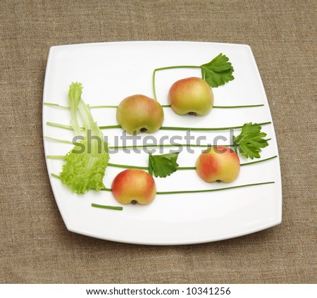 apples, lettuce and onion like music signs on white music-paper