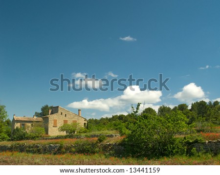 Traditional Farmhouse in Provence, France, in fields of poppies