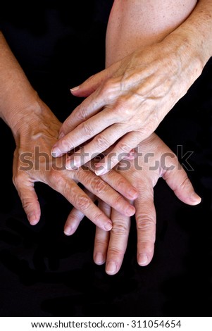 Three generations of women showing her hands.Grandmother, daughter and granddaughter