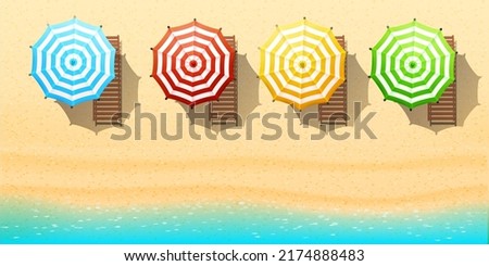 Aerial top view on the beach. Umbrellas, sunbeds, sand and ocean.