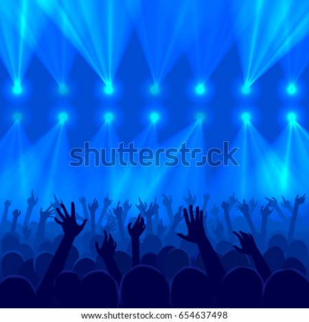 Concert crowd with raised hands silhouettes at a party in nightclub - concept of a disco lights background