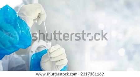 Similar – Image, Stock Photo rt-PCR COVID-19 virus disease diagnostic test,lab technician wearing blue protective gloves holding test tube with swabbing stick,swab sample equipment kit & CDC form specimen submitting guidelines