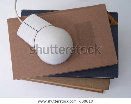 Stack of vintage books with a mouse. Conceptual for how education has changed over the years. Photo stock © 