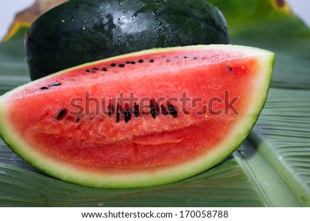 Watermelon isolated on banana leaf