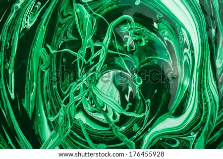 Green dye in white acrylic paint mixing process