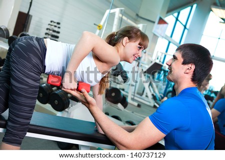 man and  woman goes in for sports in sport hall