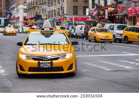 NEW YORK CITY, USA - NOVEMBER 16, 2014 : A taxi cab of New York City with some more cabs on the background.