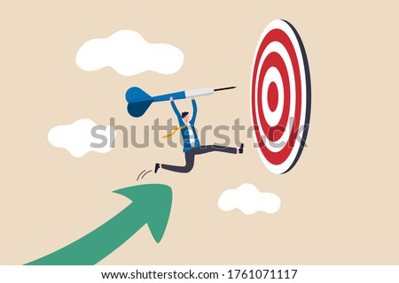 Business target achievement or success and reaching for target and goal concept, businessman leader holding dart running from rising graph arrow and jump to bullseye target to win in business strategy