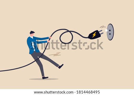 Electricity saving, ecology awareness or reduce electric cost and expense concept, man pulling electric cord to unplug to save money or for ecology power.