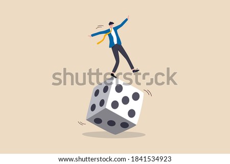 Investment risk, stock trader, gambling, uncertainty, possibility of losing money or make a profit from investment concept, greedy investor man dare trying to balance himself on spinning unstable dice
