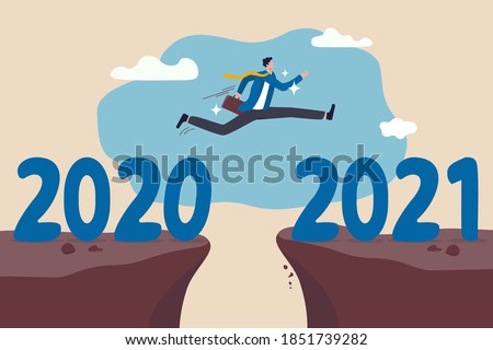 New year 2021 hope for business recovery, change year from 2020 to 2021 calendar or new challenge coming concept, confident success businessman attempt to jump high overcome risk to next cliff.