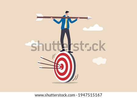 Result oriented business strategy or result driven, professionally set up and achieve business target concept, smart businessman balance and control rotating archery target with arrow hitting bullseye 商業照片 © 