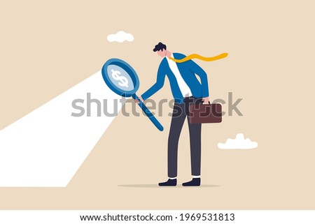 Searching for investment opportunity, stock market research or hidden cost and expense concept, businessman looking through magnifying glass to see dollar money sign search for money.