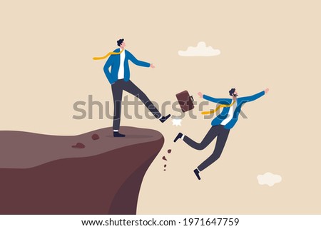 Business dishonesty, betrayal or jealousy colleague, career competitor or cheating concept, businessman kick business partner fall off the cliff. Stock foto © 